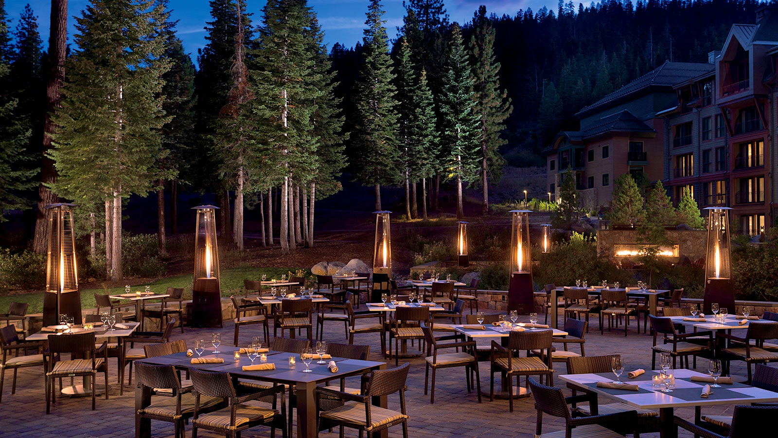 Outdoor tables, trees and heaters at Manzanita’s terrace